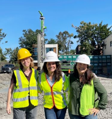 three women in safety vests and hard hats